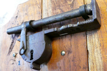 Old metal door padlock with iron forged