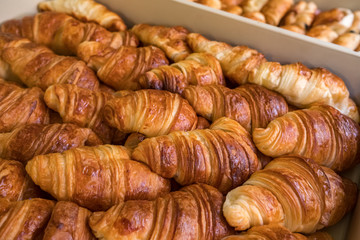 Freshly baked croissants closeup.