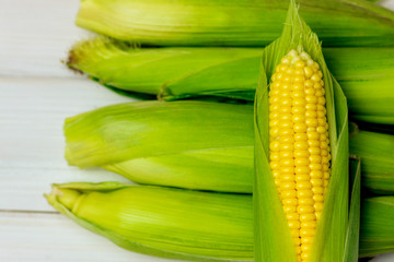 fresh and ripe corn cobs. Corn close-up. The concept of healthy eating, vegetable background, natural products, organic, vegetarian, raw food festival.