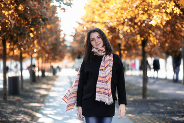 Beautiful girl in the park autumn