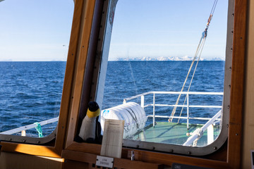 window of wheelhouse with penguin companion © Frithjof