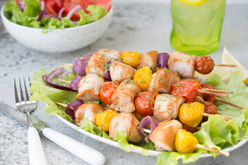 Chicken kebabs with vegetables on skewers