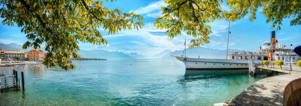 Landscape with wharf and touristic old ferry on Geneva Lake in Vevey town. Vaud canton, Switzerland