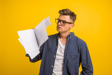 Image of  man in glasses  posing isolated over yellow wall background. People, business, job,...