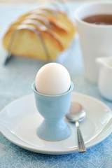 Boiled egg with toast and tea