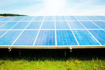 solar panels with the sunny sky. Blue solar panels. background of photovoltaic modules for...