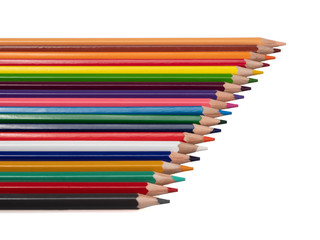 Lying colored pencils on the diagonal. On white background, isolated. Still life. Close-up.