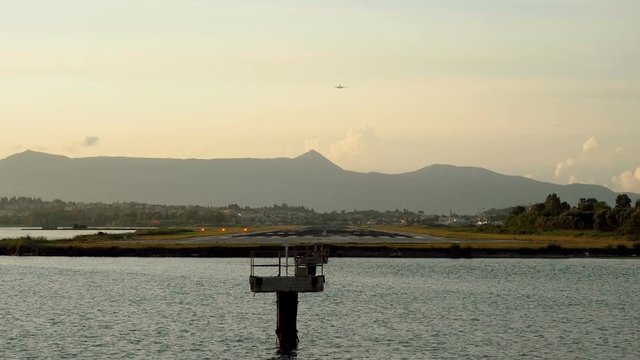 Passenger airplane flying in the sky. Aircraft taking off from the runway at the airport of Corfu. Greece. Slow motion. HD