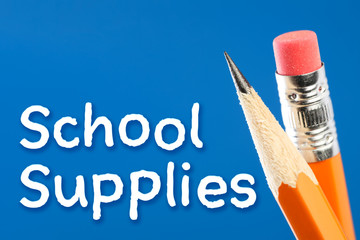 Yellow pencil close up with School Supplies text