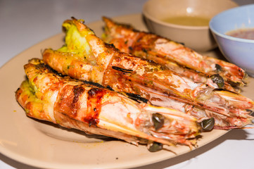Grilled prawn sea shrimp in disk with sauce