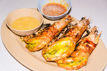 Grilled prawn sea shrimp in disk with sauce