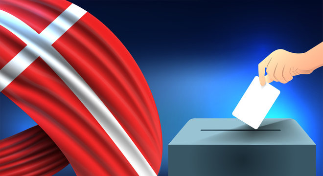 Male hand puts down a white sheet of paper with a mark as a symbol of a ballot paper against the background of the denmark flag, denmark the symbol of elections