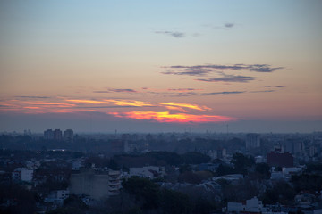 Sunset from above buildings at Coghlan, Buenos Aires, Argentina. Wide Sky with clouds and beautiful view.
