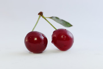 Bright colorful cherry berries on a white background