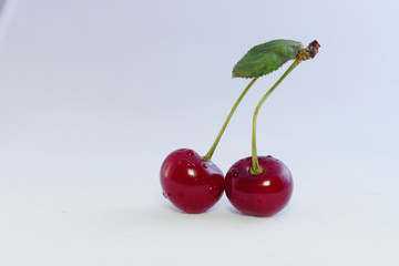 Bright colorful cherry berries on a white background