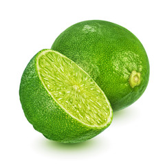 Whole and halved lime isolated on white