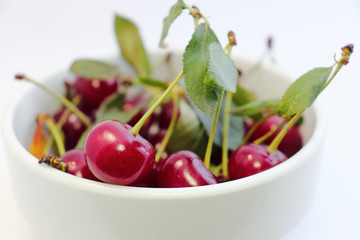 Bright colorful cherry berries on a white background