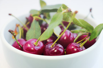 Bright colorful cherry berries on a white background