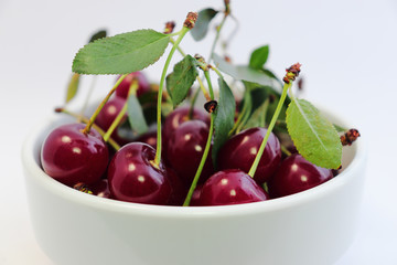 Bright colorful cherry berries on a white background