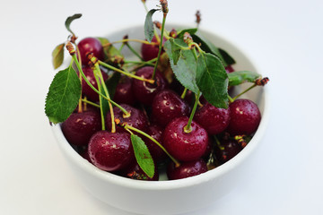 Bright colorful cherry berries on a white background
