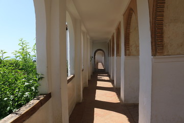 sunlit passage in alhambra spain