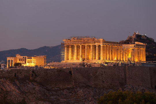 Athens, Greece - July 20, 2019: The Acropolis of Athens Unesco heritage with the Parthenon illuminated at night