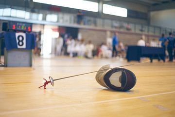 Floret and mask, equipment for fencing competition.