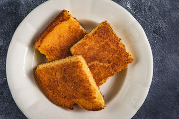 Corn Bread Squares Slices on Dark Rustic Background