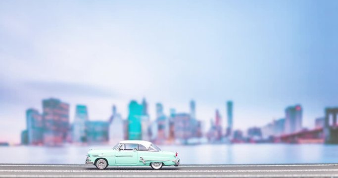 Time lapse of a light blue retro car figurine moving from right to left on a highroad model with a city image in the background, passing twice.