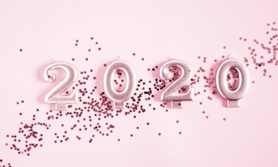 Happy New Year 2020 on pastel pink background. Flat lay, top view, copy space