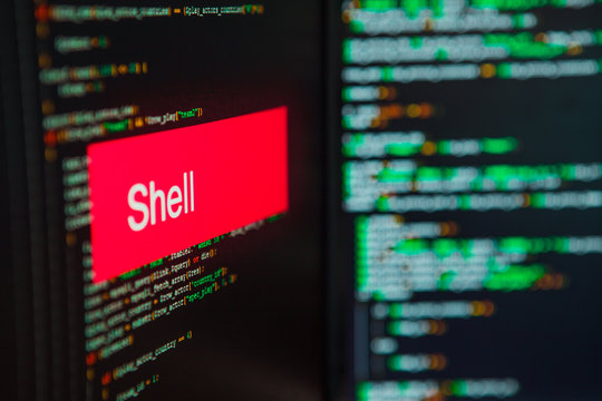 Programming language, Shell inscription on the background of computer code.