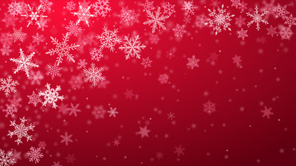 Christmas background of complex blurred and clear falling snowflakes in red colors with bokeh effect