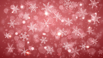 Christmas background of complex blurred and clear falling snowflakes in peach colors with bokeh effect