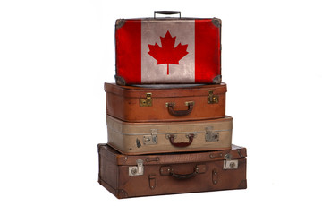 Canada, Canadian travel concept. Group of vintage suitcases isolated on white background.
