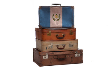 Guatemala, Guatemalan travel concept. Group of vintage suitcases isolated on white background.