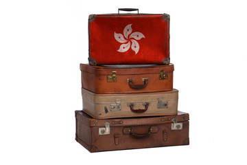 Hong Kong, China travel concept. Group of vintage suitcases isolated on white background.