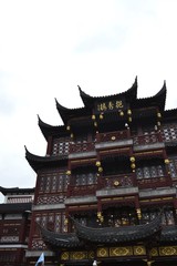 Looking up at replica of traditional Chinese building
