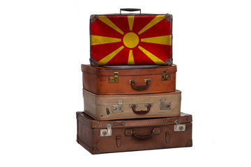 Macedonia, Macedonian travel concept. Group of vintage suitcases isolated on white background.