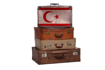 Northern Cyprus travel concept. Group of vintage suitcases isolated on white background.