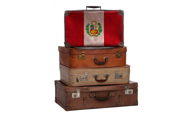 Peru, Peruan travel concept. Group of vintage suitcases isolated on white background.