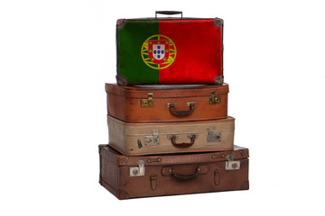 Portugal, Portuguese travel concept. Group of vintage suitcases isolated on white background.