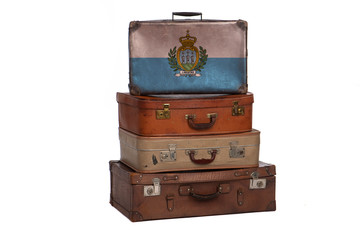 San Marino, Sammarinese travel concept. Group of vintage suitcases isolated on white background.