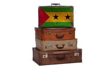 Sao Tome and Principe travel concept. Group of vintage suitcases isolated on white background.