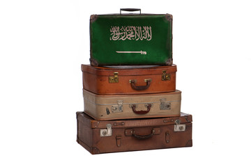 Saudi Arabia, Arabian travel concept. Group of vintage suitcases isolated on white background.