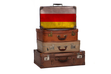 South Ossetia travel concept. Group of vintage suitcases isolated on white background.
