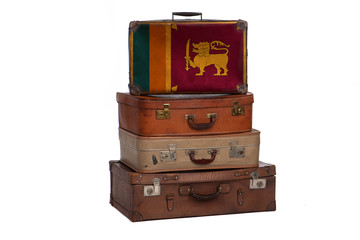 Sri Lanka, Sri Lankan travel concept. Group of vintage suitcases isolated on white background.