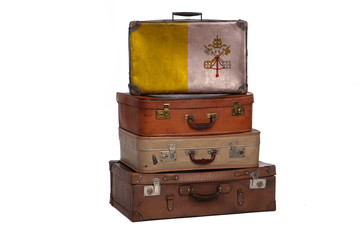 Vatican city travel concept. Group of vintage suitcases isolated on white background.