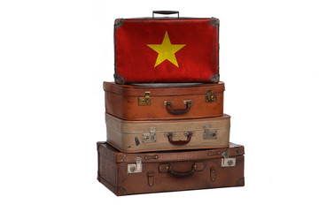 Vietnam, Vietnamese travel concept. Group of vintage suitcases isolated on white background.