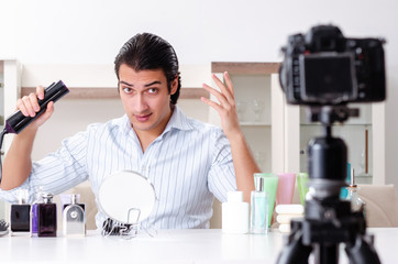 Young handsome man recording his blog in hygiene concept
