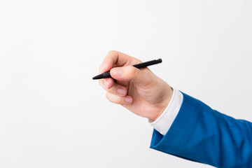 Isolated hand above white background hold pen. Pointing pen in the hand above white background.